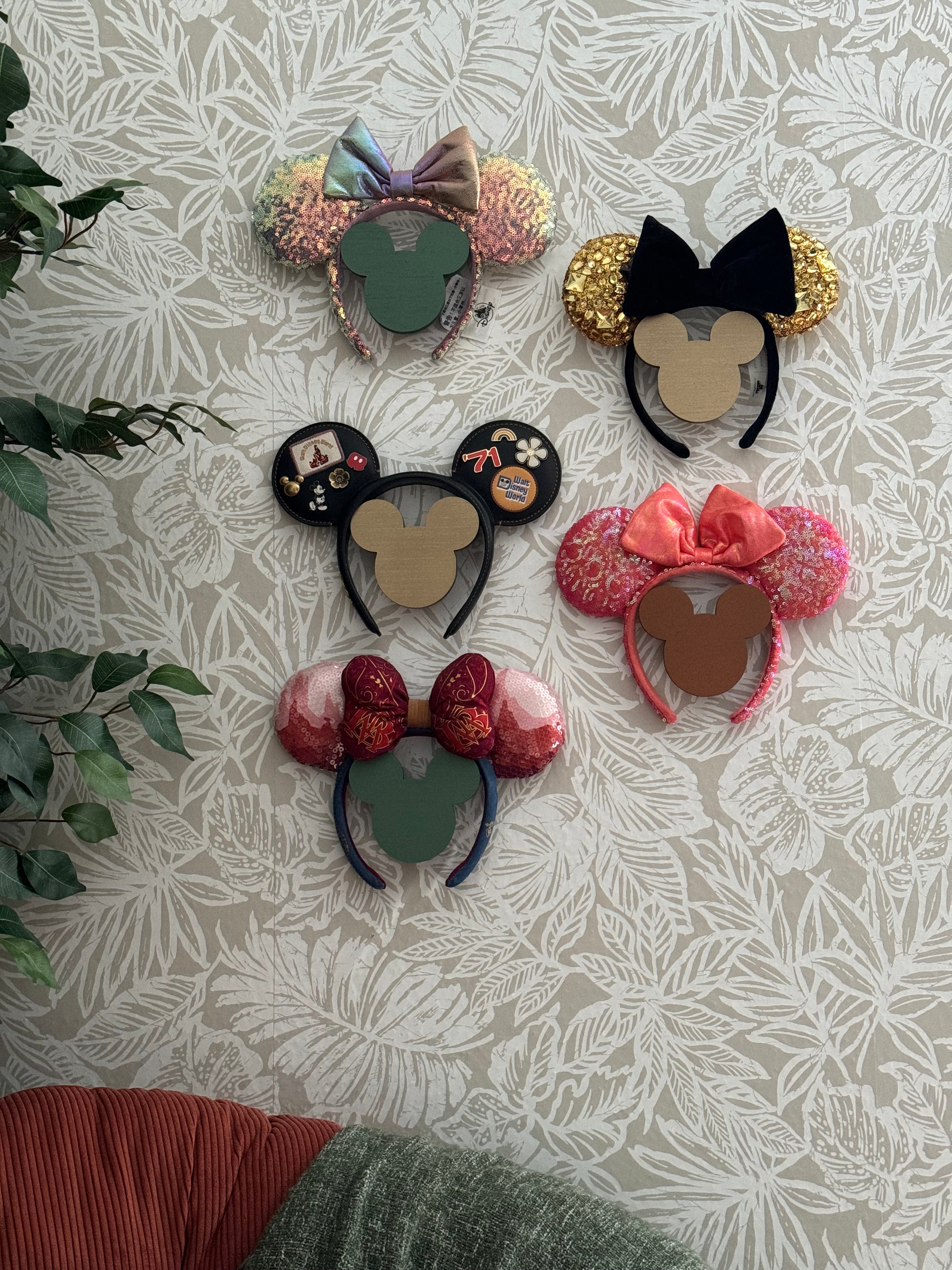 Minnie Ears Wall HolderOur girls have so many ears and just added more on our last trip. We were displaying them on our Disney Ear Frames… but now we have too many. This Mickey silhouette Minnie Ears Wall Holder