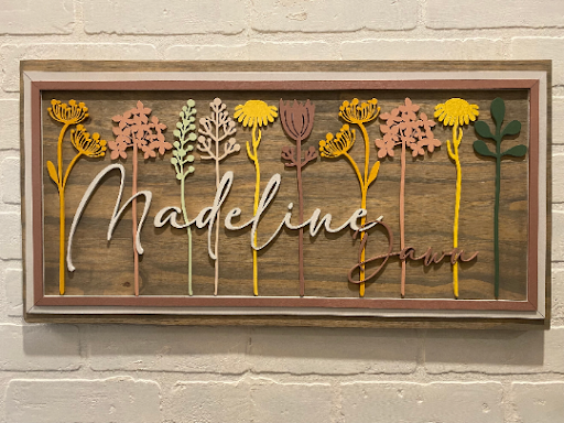 Floral Stem Nursery BoardThis adorable wood nursery sign would be a perfect addition to any little one’s room. 

This personalized sign is solid wood. 
3 sizes available -
12”x24 - Small
16xFloral Stem Nursery Board