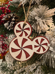 Mickey Peppermint OrnamentAdd a little Disney Magic to your tree or gift package with this cute peppermint ornament. 

Ornaments are made to order. 
Made from 2 layers of Birch. Ornament measMickey Peppermint Ornament