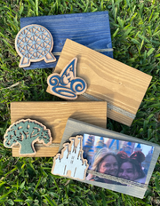 Park Icon Picture FrameGreat way to display your Disney park Memories. Frame holds a 4x6 photo. 
Wood frame stained your choice. Park Icon is laser cut , hand painted , layered and attachePark Icon Picture Frame