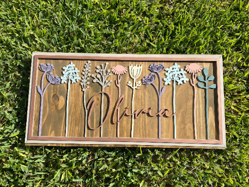 Floral Stem Nursery BoardThis adorable wood nursery sign would be a perfect addition to any little one’s room. 

This personalized sign is solid wood. 
3 sizes available -
12”x24 - Small
16xFloral Stem Nursery Board